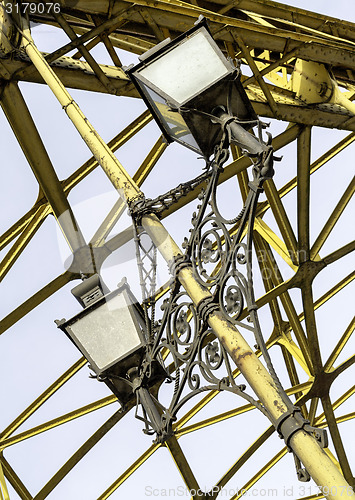 Image of Decorative lamps hanging from bridge