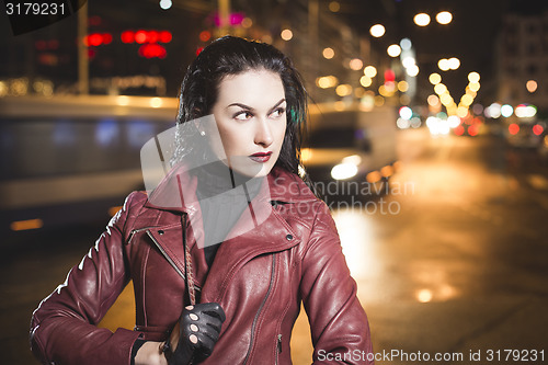 Image of Business woman on a city traffic bokeh background