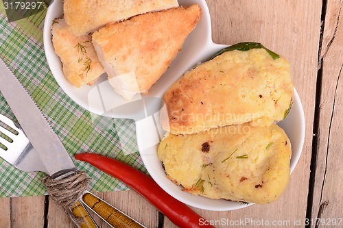 Image of Fresh meat on white plate with red pepper