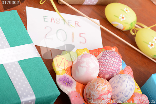 Image of Easter setting with gift box and spring decoration