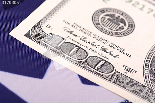 Image of american dollars on american flag