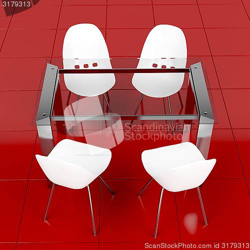 Image of Glass table and white chairs