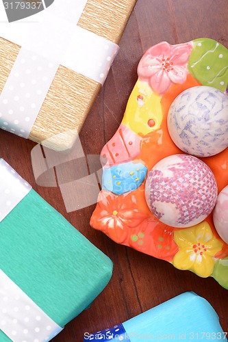 Image of Easter setting with gift box and spring decoration