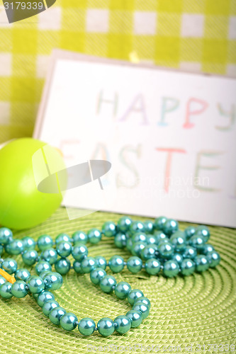 Image of Easter setting with gift box and spring decoration