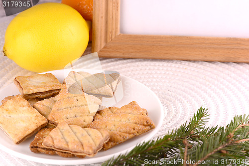 Image of sweet cake on white plate and fruits