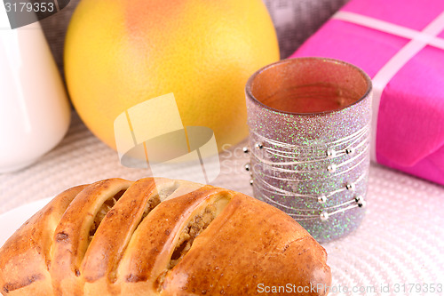 Image of sweet cake on white plate and fruits