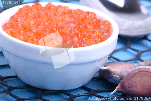 Image of close up red caviar with garlic