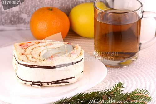 Image of sweet cake on white plate and fruits