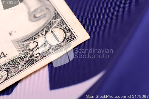 Image of american dollars on american flag