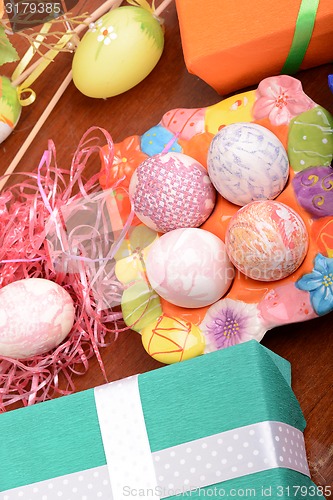 Image of Easter setting with gift box and spring decoration