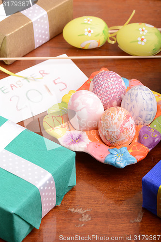 Image of Easter setting with gift box and spring decoration