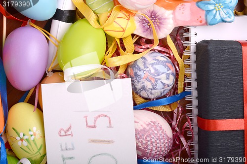 Image of Easter setting with gift box and spring decoration