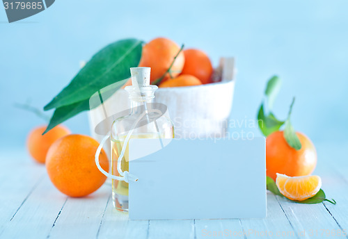 Image of tangerines and oil in bottle