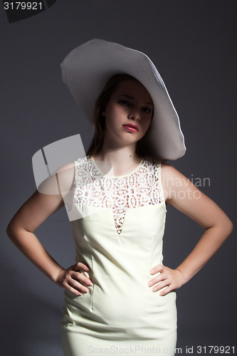 Image of Young lady in white hat