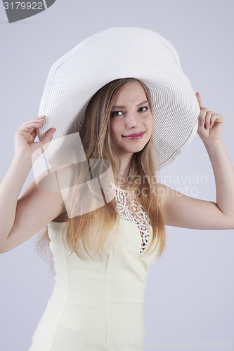 Image of Young lady in white hat