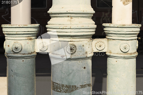 Image of Three old poles