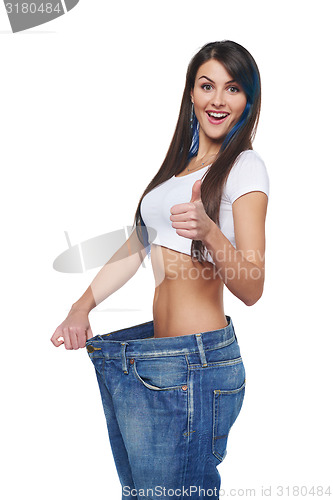 Image of Young woman delighted with her dieting results