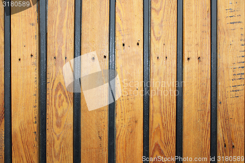 Image of wooden texture with metal bars