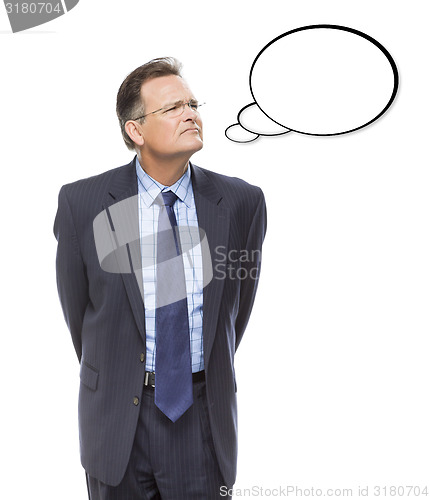 Image of Businessman Looking Up At Blank Thought Bubble on White