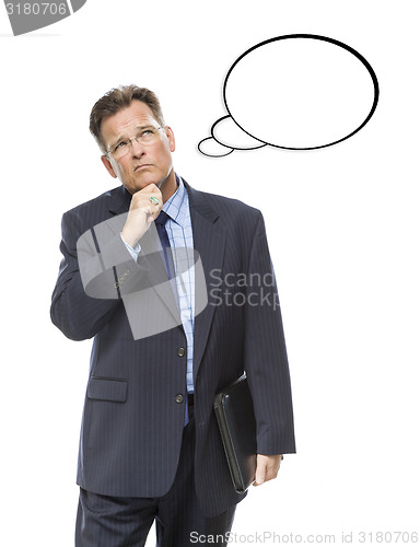 Image of Pensive Businessman Looking Up At Blank Thought Bubble