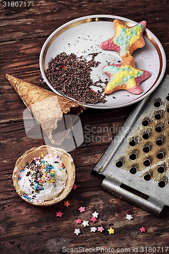 Image of ice cream decorated with sweet powder in the wafer 