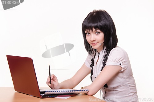 Image of Girl - call-center employee at the desk