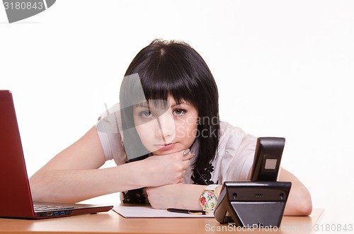 Image of Tortured call-center employee at the desk