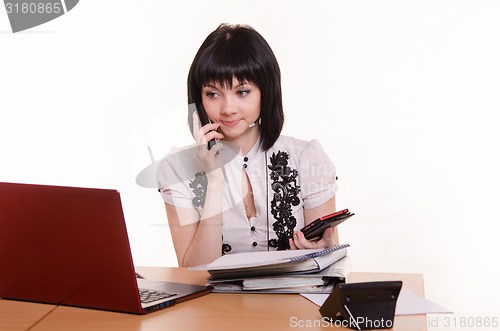 Image of Call-center worker talking on the phone