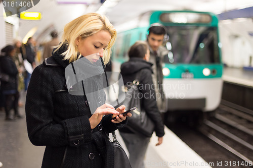 Image of Woman on a subway station.