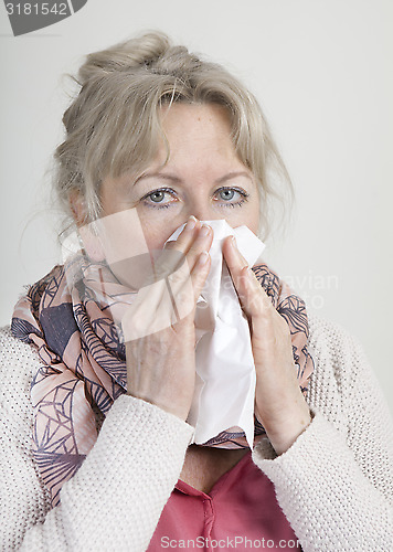 Image of cold elderly woman