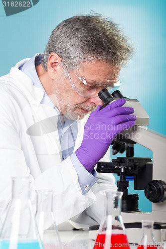 Image of Life science researcher microscoping.
