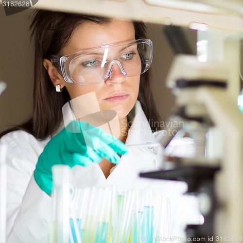 Image of Young chemist in the laboratory.
