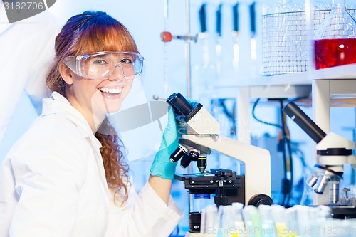 Image of Young scientist having fun in lab.