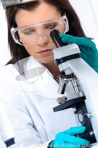 Image of Young chemist in the laboratory.