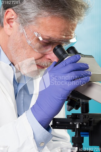 Image of Life science researcher microscoping.