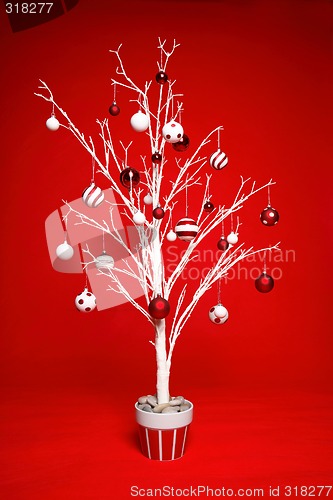 Image of Christmas Tree decorated in red and white baubles.