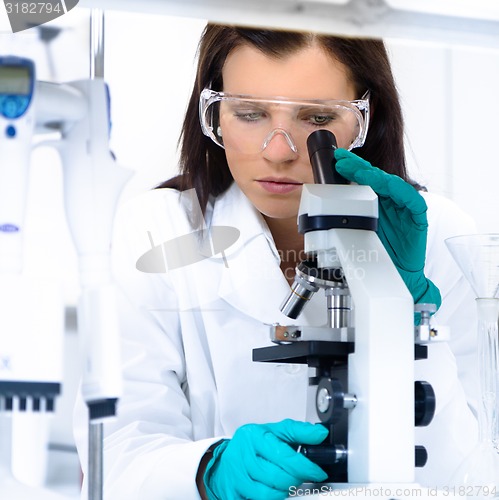 Image of Young chemist in the laboratory.