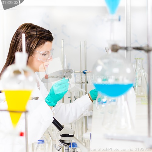 Image of Young chemist in the laboratory.