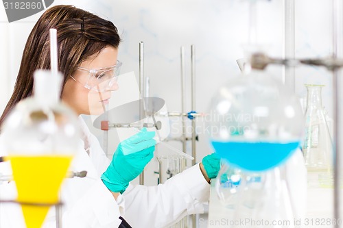 Image of Young chemist in the laboratory.