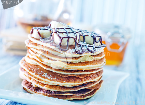 Image of pancakes with banana and chocolate