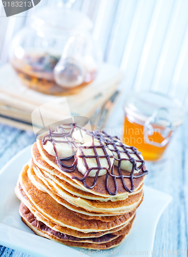 Image of pancakes with banana and chocolate