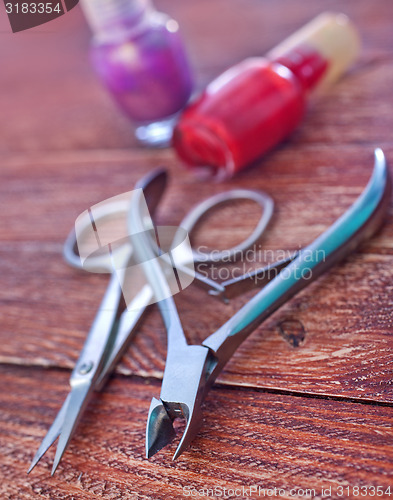 Image of nail and scissors