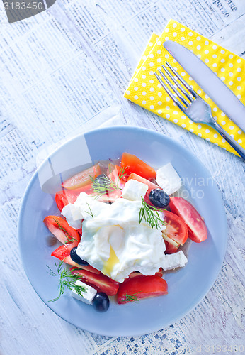 Image of poached egg and salad