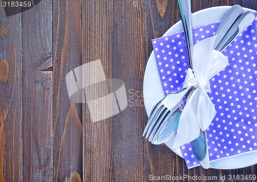 Image of fork, knife and plate