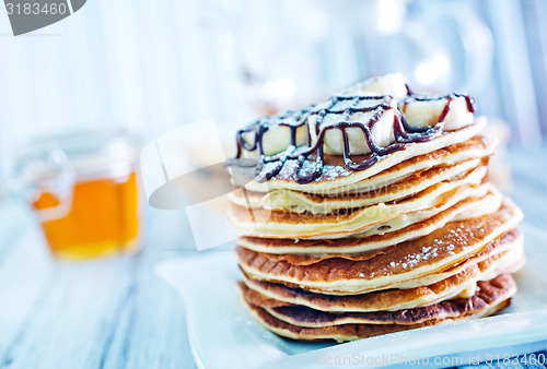 Image of pancakes with banana and chocolate