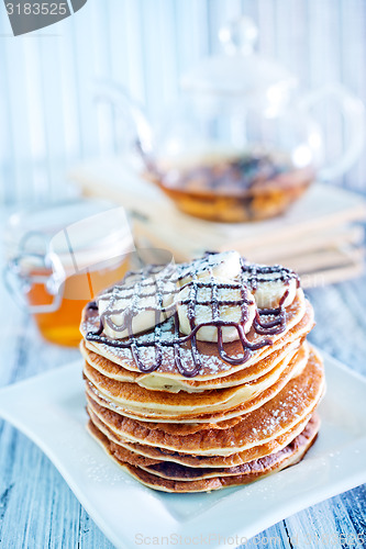 Image of pancakes with banana and chocolate