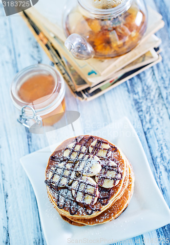 Image of pancakes with banana and chocolate