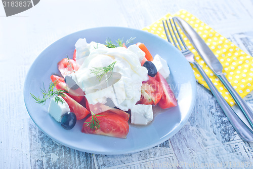 Image of poached egg and salad