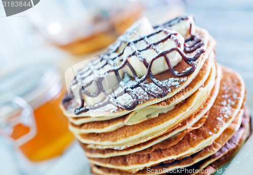 Image of pancakes with banana and chocolate