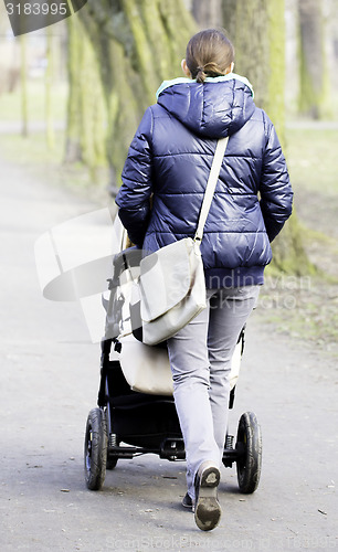 Image of Young mother with  pram 